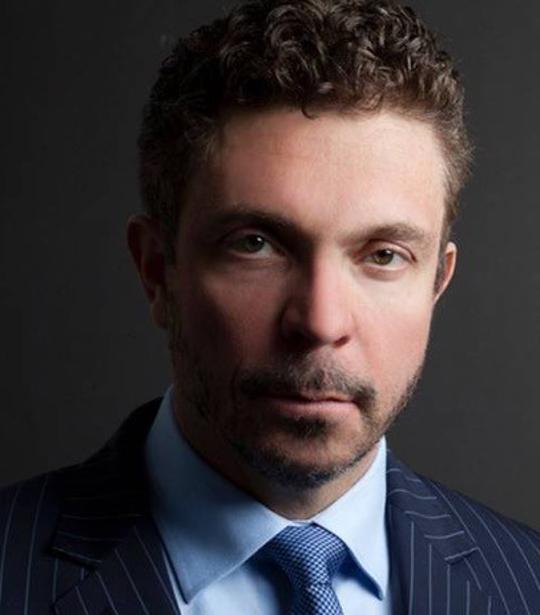 headshot of man with beard