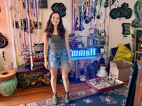 woman in neon light store